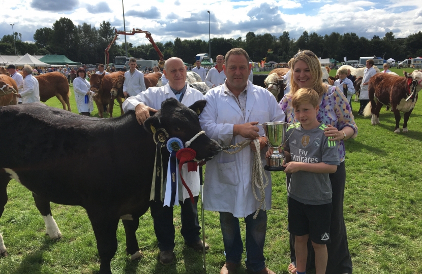 Karen and her son presenting cattle awards